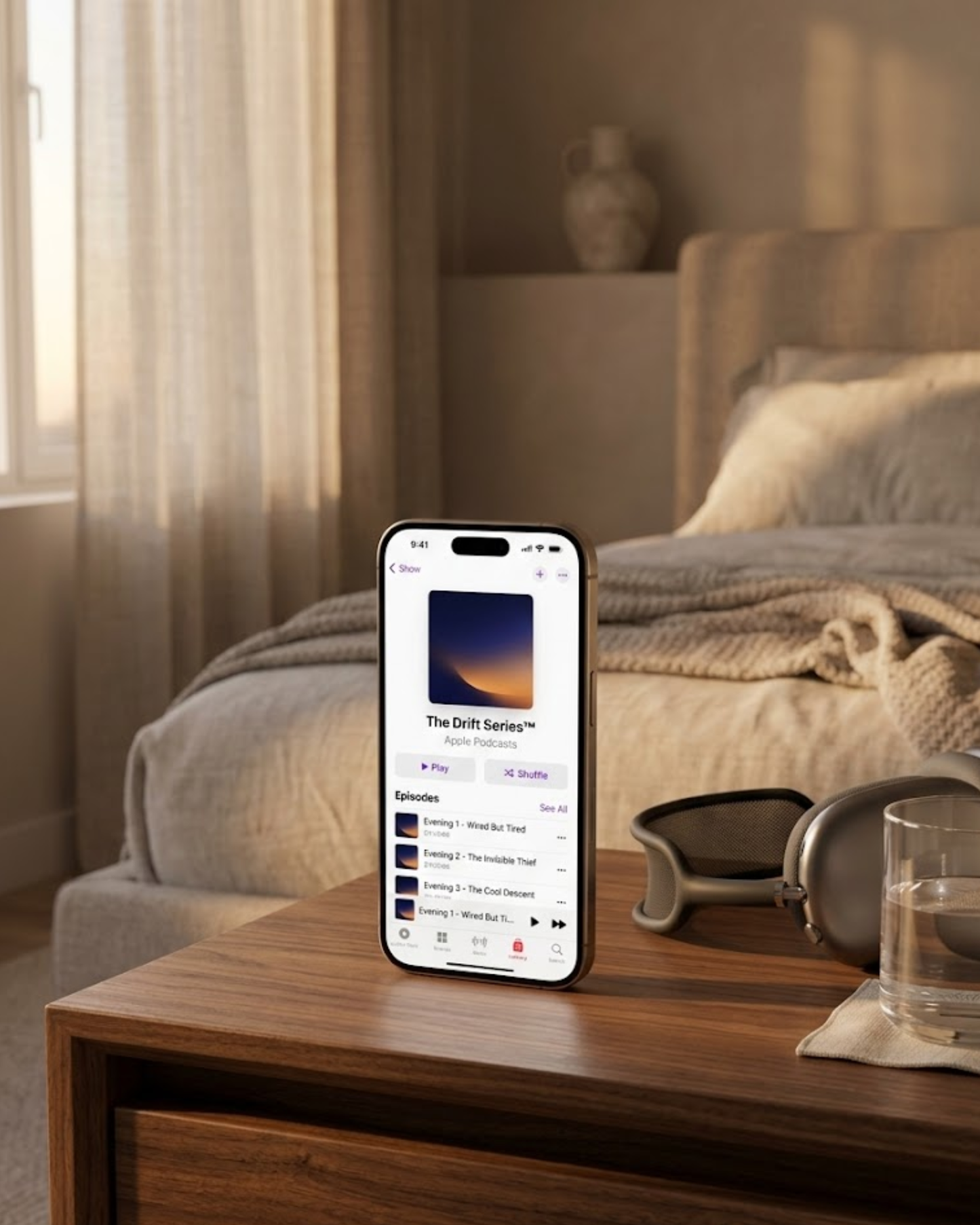 Collagen Rituals Drift Series bedtime audio ritual on iPhone nightstand with headphones and water in peaceful evening bedroom for skin restoration